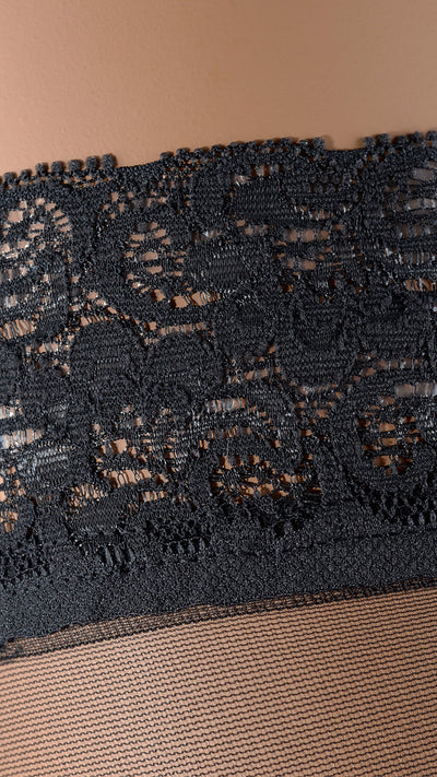 Fanny 15 Den Lace Top Thigh Highs feature an elegant lace design perfect for adding allure to any outfit.