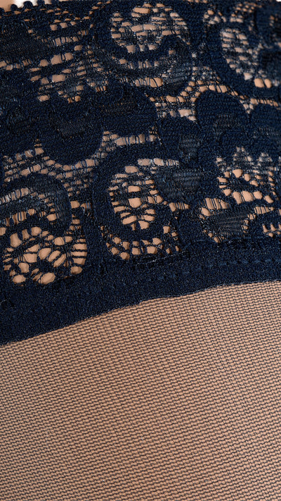 Fanny 15 Den Lace Top Thigh Highs showcase elegant lace detailing for a romantic touch to your outfit.