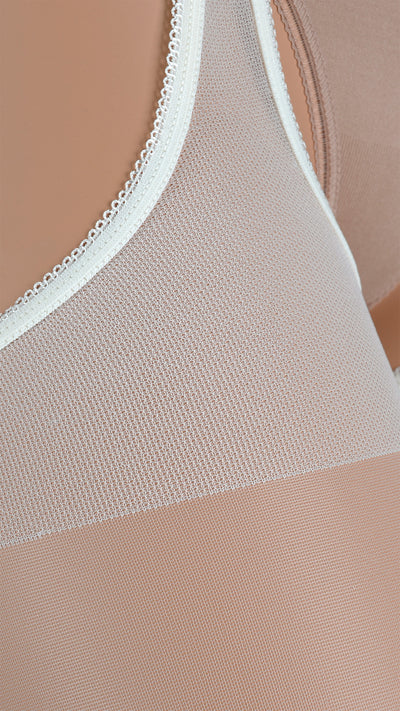 Scandal 20 Den Strip Panty Suspender Pantyhose enhance allure with delicate design and seductive elegance.