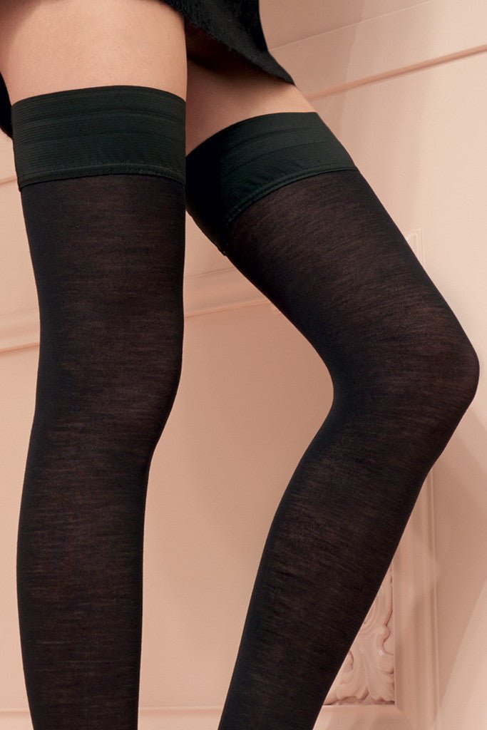 Stylish and warm, the Jennifer 100 Den Merino Wool Thigh Highs by Trasparenze are perfect for cooler days.