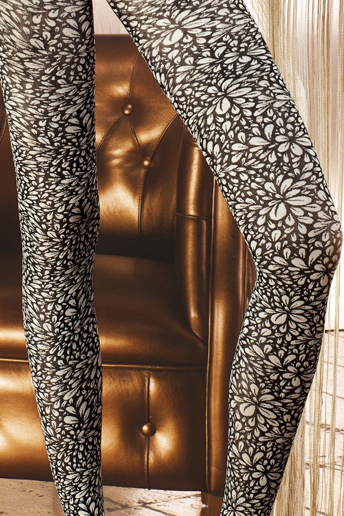 Stylish Trasparenze Leucite Fashion Tights feature an allover flower print in matte black and white, perfect for spring.