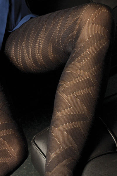 Stylish legs adorned in Mellotron 80 Den Fashion Tights by Trasparenze, showcasing elegant, modern patterns.
