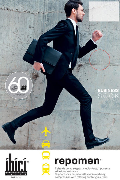 Dynamic man in a suit wearing Repomen Compression Socks 16-20 mmHg 21-27 hPa for travel and fitness by Ibici.